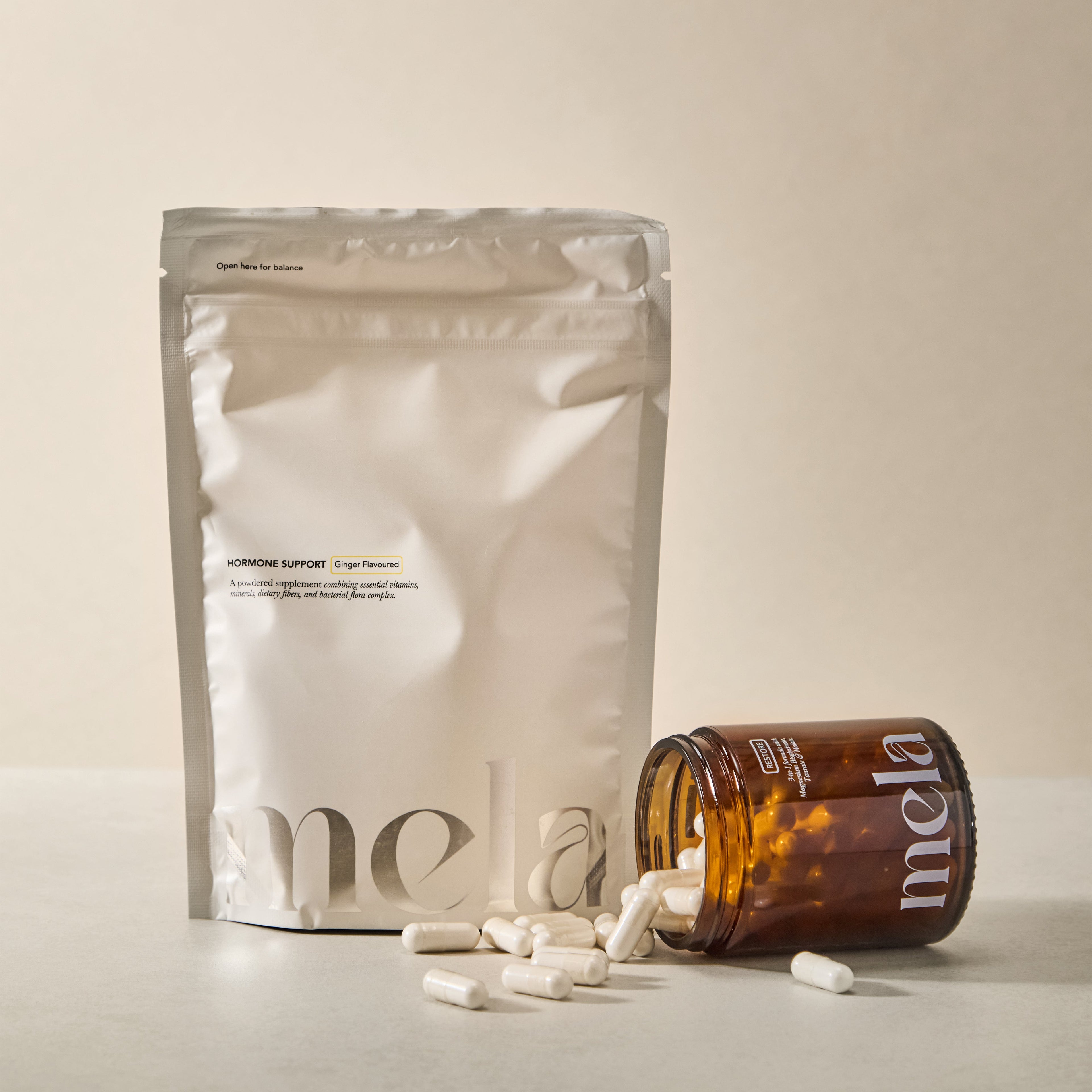 Mela supplement packaging with a beige background